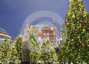 Christmas New Year holidays illumination and State Historical Museum inscription in Russian at night, Moscow