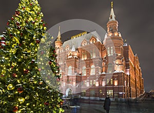 Christmas New Year holidays illumination and State Historical Museum inscription in Russian at night, Moscow