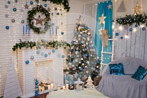 Christmas and New Year living room interior with decorated fir tree, fireplace and blue armchair