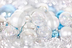 Christmas and New Year pattern, ornament of Christmas balls and tinsel, winter fairytale decor in blue and white color