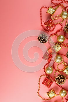 Christmas or new Year pink background with red and gold decorations for Christmas tree with free space