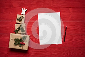 Christmas or New Year presents on red wooden planks