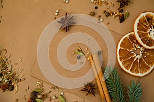 Christmas and New Year`s background with copy space. Vintage envelope with letter lying on table with star anise, spruce branch,