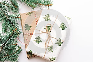 Christmas or new year`s background, plain composition of Christmas gifts and fir branches, Flatlay, empty space for greeting text