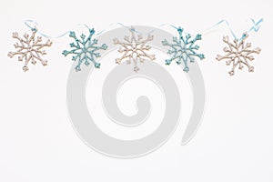 Christmas or New Year`s composition 2021. Beautiful xmas blue and silver decorations on a white background and copy space.