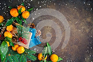 Christmas and New Year`s composition with fresh tangerines, Happy New Year and Merry Christmas. Selective focus.