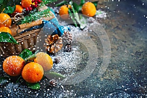 Christmas and New Year`s composition with fresh tangerines, Happy New Year and Merry Christmas. Selective focus.