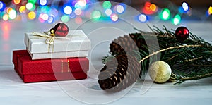 Christmas or New Year`s composition with gifts on a white background with a multi-colored boke. Selective focus