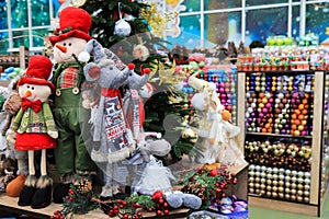 Christmas and New Year`s toys. Toy rat 2020 character and funny dolls in hats on toy store.