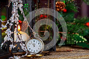 Christmas and New Year s vintage clock showing five to midnight. Festive evening burning candle