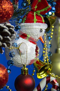 Christmas new year snowman snowman close-up on blue background