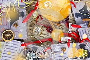 Christmas or New Year still-life with red, gold and silver ribbons, cones, cinnamon sticks, stars of anise