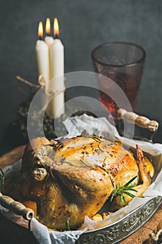 Christmas and New Year table set with roasted whole chicken