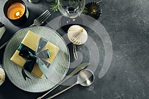 Christmas or New Year table setting on dark background. Flat lay, top view, copy space