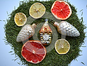 Christmas and New year time green decor toys and fruits background