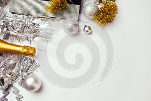 Christmas and New Year white background with champagne, silver and golden decorations. Party masquerade celebration