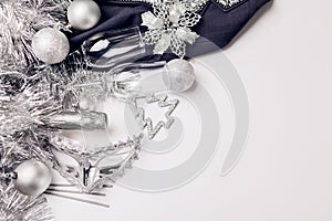 Christmas and New Year white background with champagne, silver and golden decorations. Party masquerade celebration