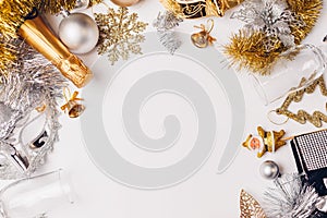 Christmas and New Year white background with champagne, sparklers, silver and golden decorations. Party celebration