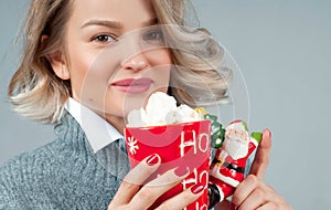 Christmas and New Year. Woman is drinking hot coffee.