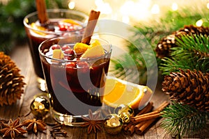 Christmas, New Year, Xmas mulled red wine with spices, cranberry and oranges. Traditional hot drink or beverage