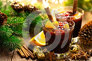 Christmas, New Year, Xmas mulled red wine with spices, cranberry and oranges. Traditional hot drink or beverage