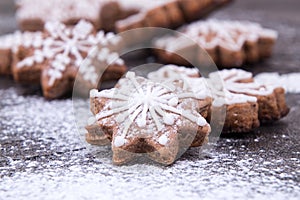 Christmas New Yeargingerbread cookies on sugar powder background
