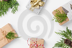 Christmas New Years frame composition with gift boxes pine cones cypress tree branches on white background. Holiday card poster