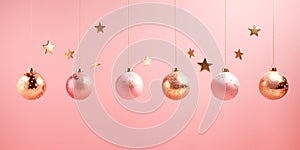 Christmas New Years greeting card banner with ornament balls hanging on chain on pink background. Template with copy space