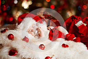 Christmas newborn baby sleeping in Santa hat