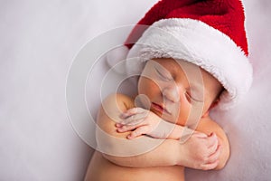 Christmas Newborn Baby Wearing Santa Hat and Sleeping
