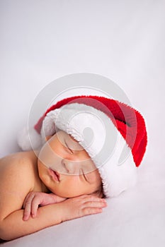 Christmas Newborn Baby Wearing Santa Hat and Sleeping