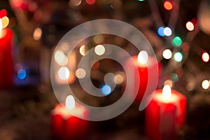 Christmas night, defocus and blured Christmas candle on table