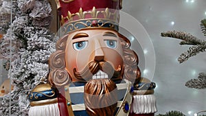Christmas nutcracker on the background of New Year holiday decorations
