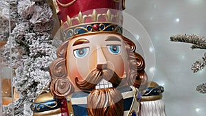 Christmas nutcracker on the background of New Year holiday decorations