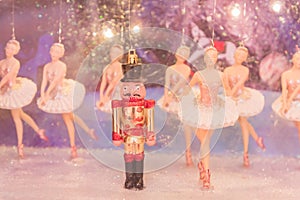 Christmas nutcracker toy soldier and balerina dolls on the stage. Famous Russian Ballet installation