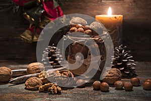 Christmas nuts and hazelnuts with candle photo