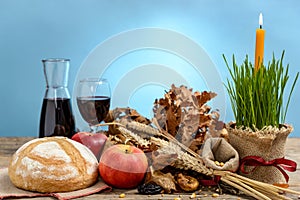 Christmas oak tree, candle, bread and dried fruits