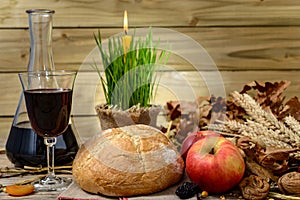 Christmas oak tree, candle, bread and dried fruits