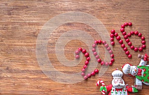 Christmas - old wooden background, funny chefs Santa Claus and Snowman, and sign 2016