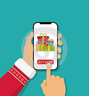 Christmas online gifts. Mobile app in phone for xmas holiday. Smartphone in hand with online shop and delivery. Shopping cart with