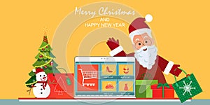Christmas online shopping concept on laptop screen with gift boxes