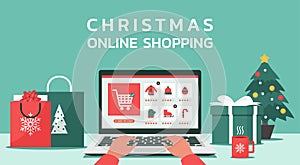 Christmas online shopping and text concept, human hand makes order on laptop