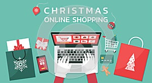 Christmas online shopping top view concept, Santa Claus hand makes order on laptop screen