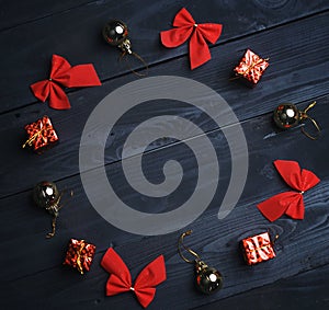 Christmas Ornament Formed Circle on Black Wooden Texture. Top Vi