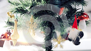 Christmas Ornament With gold Snowflakes, under pine tree, Merry Christmas and Happy New Year