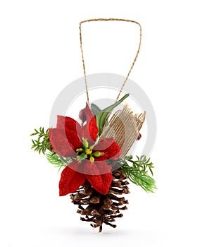 Christmas ornament with pine cone and branch. It also has a red star