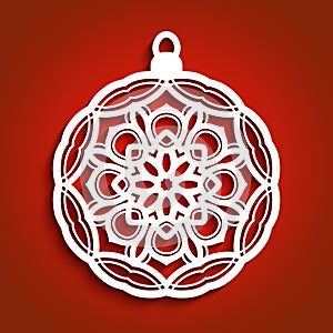 Christmas ornament on red background, cutout paper bauble