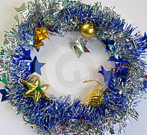 Christmas ornament in silver and blue on white background.