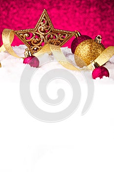 Christmas ornament in snow on glitter background