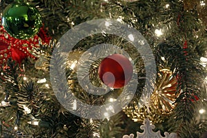 Christmas ornament on tree with lights